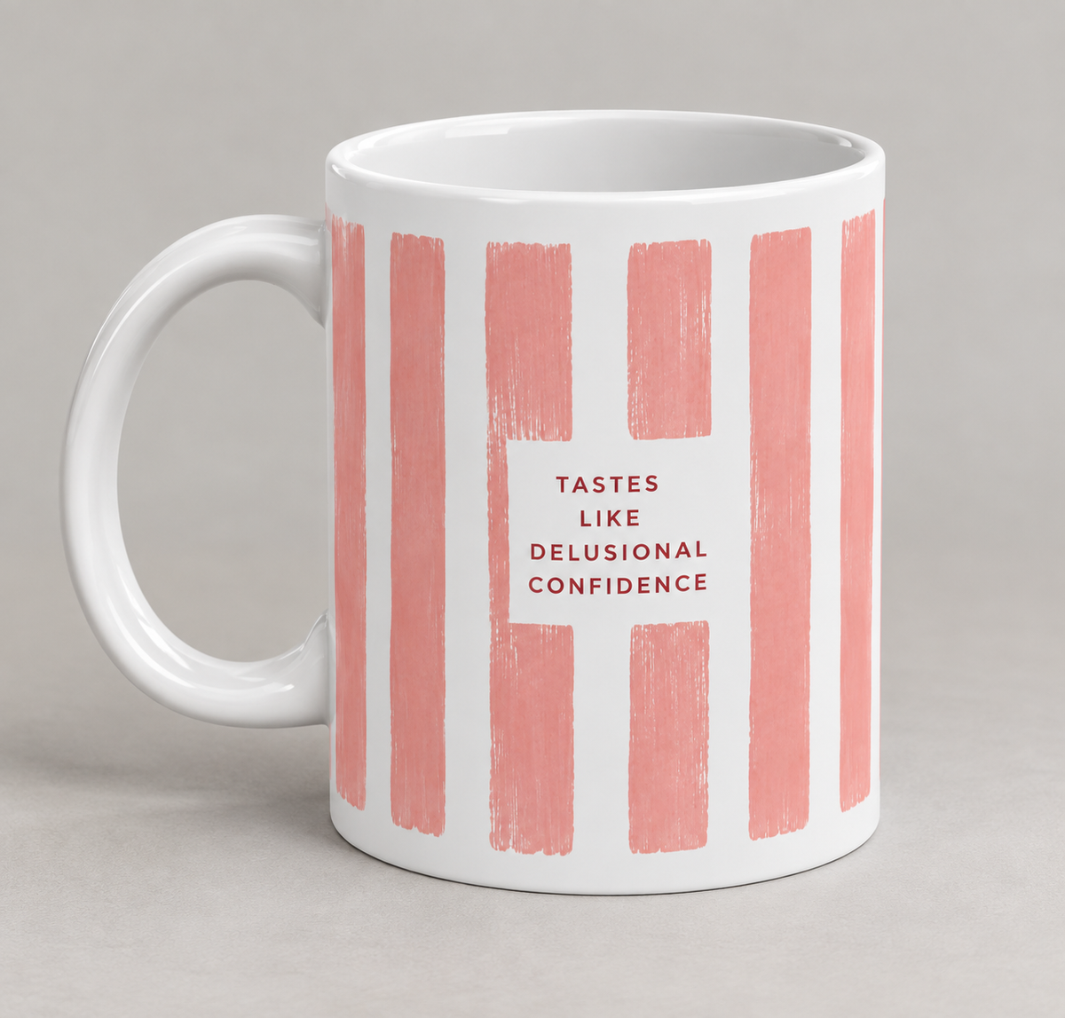 Tastes Like Delusional Confidence mug – white 11oz ceramic coffee mug with dusty pink stripes
