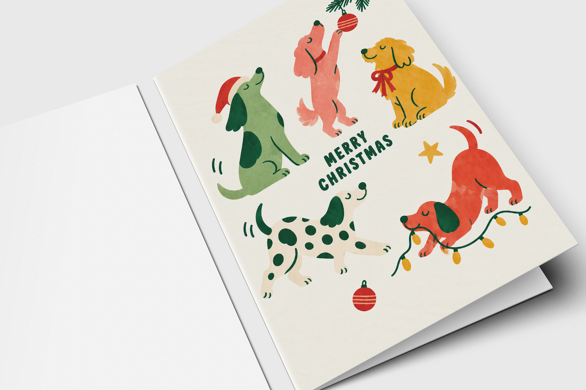 Dog Christmas card with playful puppies, ornaments, holiday lights and hand-lettered Merry Christmas
