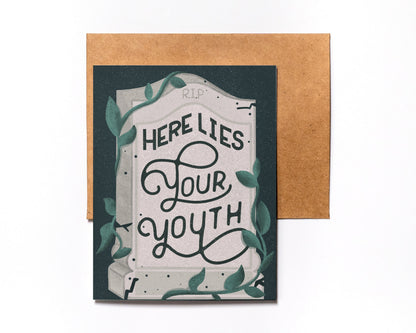 Here Lies Your Youth birthday card with kraft envelope