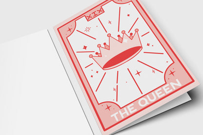 'The Queen' tarot-style card in pink and red with a jeweled crown in a sunburst