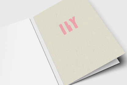 Minimalist ILY love card with soft pink letters on speckled cream