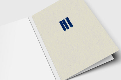 Minimalist Hi note card with bold navy letters on speckled cream
