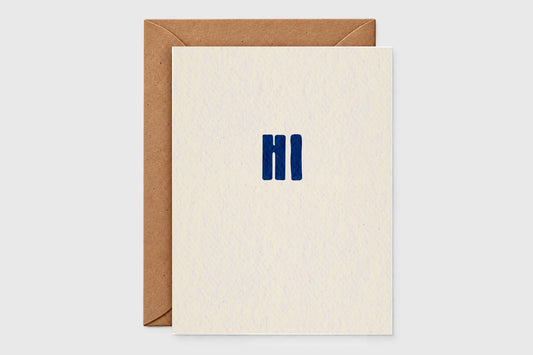 Minimalist Hi note card with bold navy letters on speckled cream