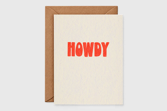 Minimalist Howdy card with bold red-orange retro letters on speckled cream