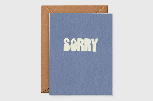 Minimalist Sorry apology card with pale yellow retro letters on slate blue