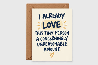 I Already Love This Tiny Person new baby card with navy hand-lettering and yellow accent on cream background