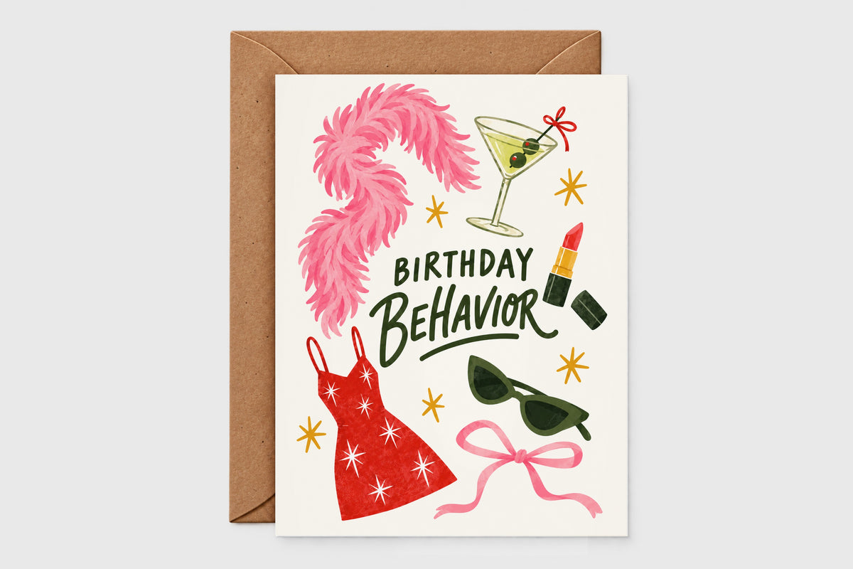 Birthday Behavior card with pink feather boa, martini, lipstick and red sparkly dress illustrations on a beige background