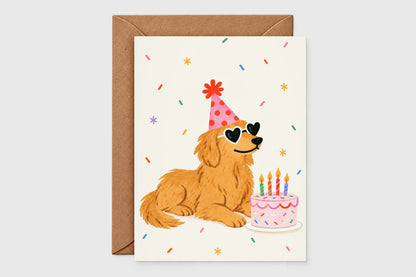 Golden retriever birthday card with party hat, heart sunglasses and sprinkle cake on cream background