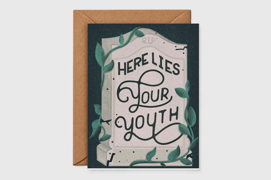Funny birthday card with a hand-lettered tombstone reading 'Here Lies Your Youth' and ivy on dark green