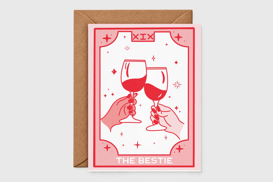 'The Bestie' tarot-style best friend card in pink and red with two hands clinking wine glasses