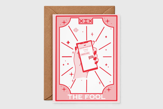 'The Fool' tarot-style breakup card in pink and red with a hand holding a phone